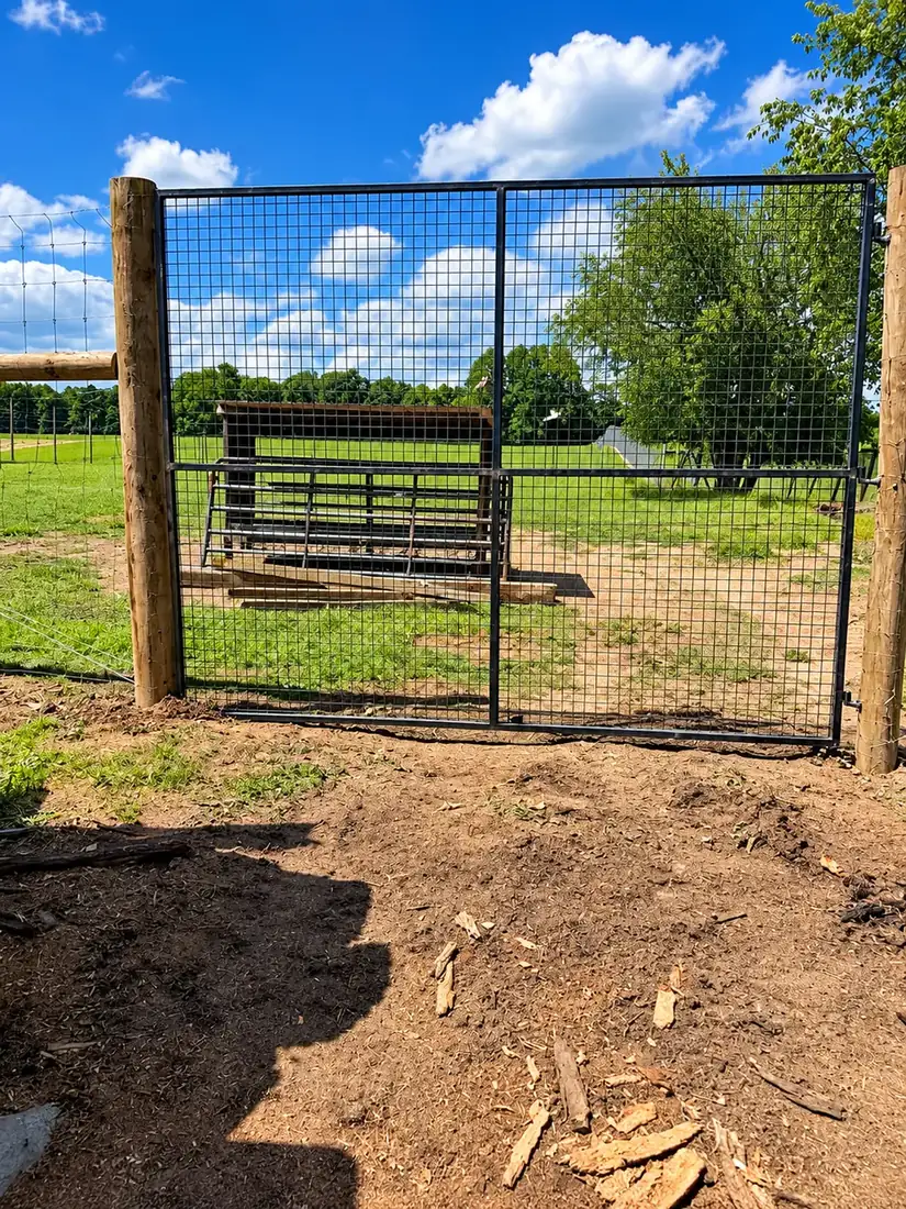 Wire fence with a wide gate